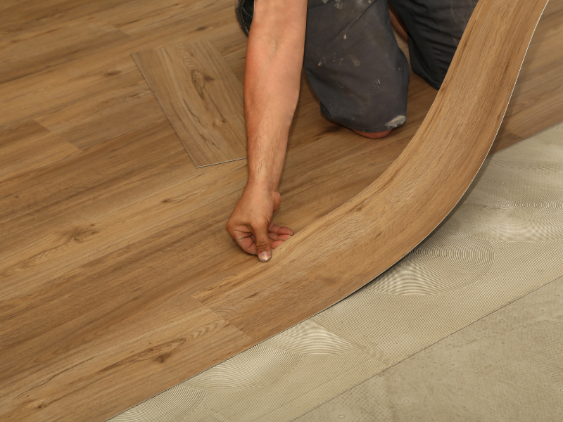 Man laying flooring